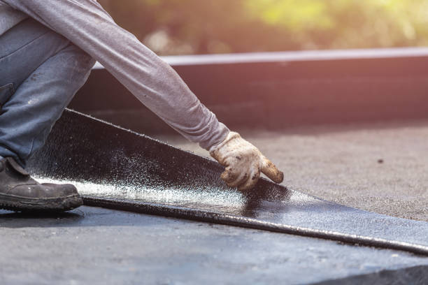 Professional Basement Waterproofing technician working in Hillsboro, IL